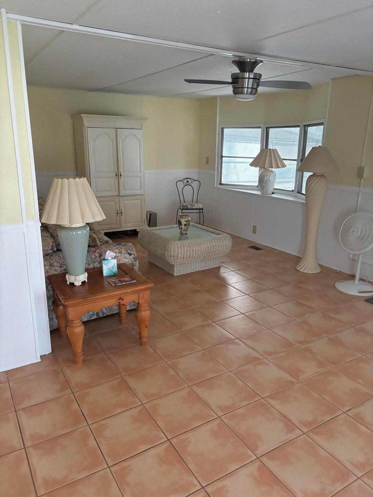 a dining room with granite countertop a couch and a window