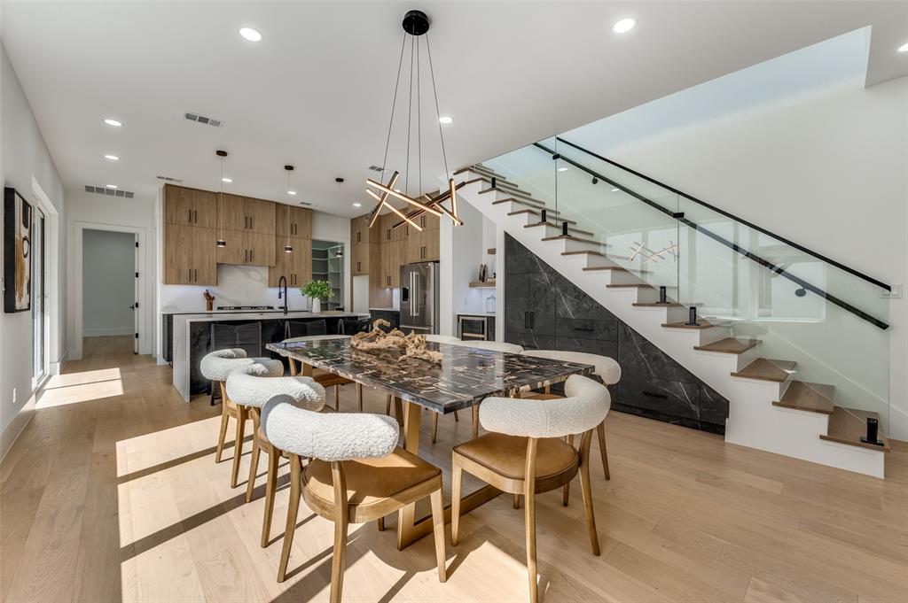 a dining room with furniture and entryway