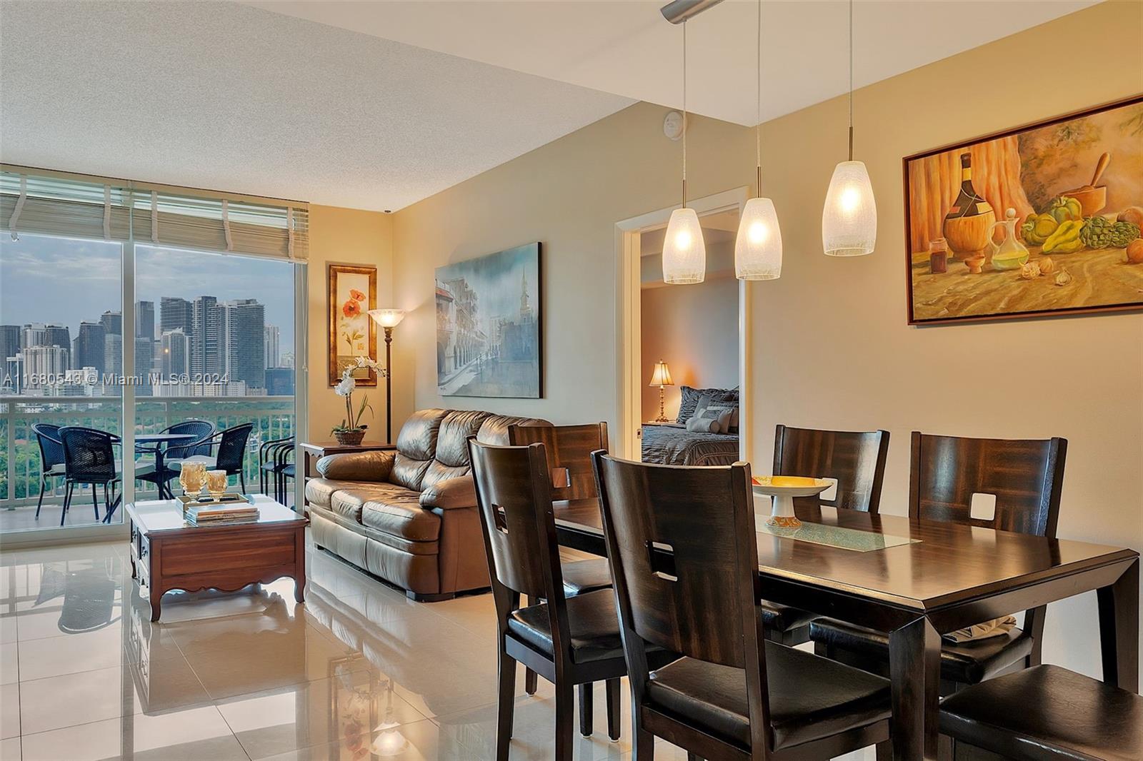 a view of a dining room with furniture and a potted plant