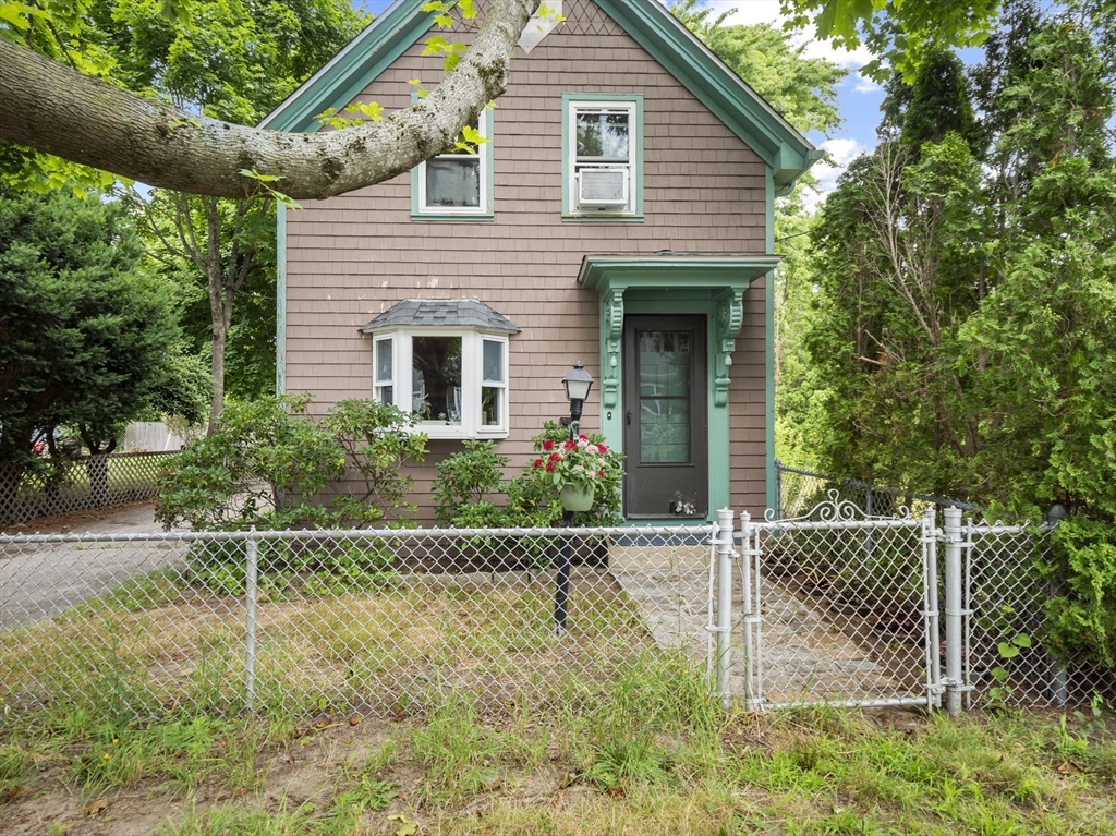 a house with trees in the background