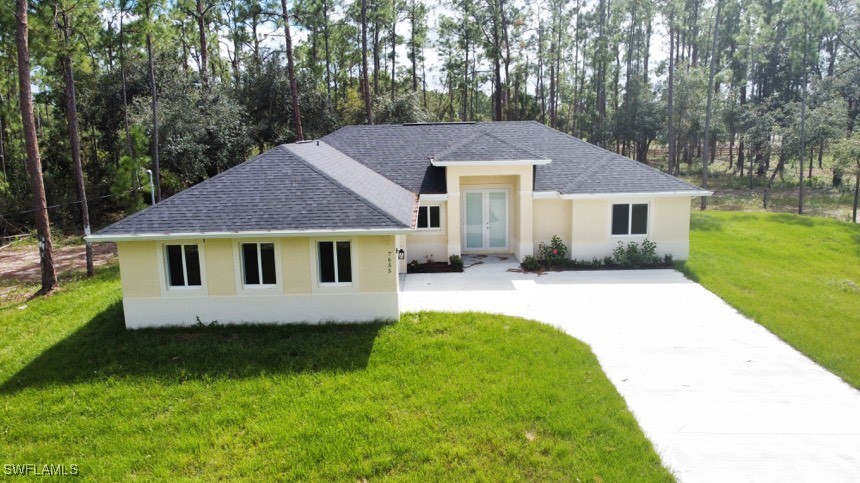 a front view of a house with a yard