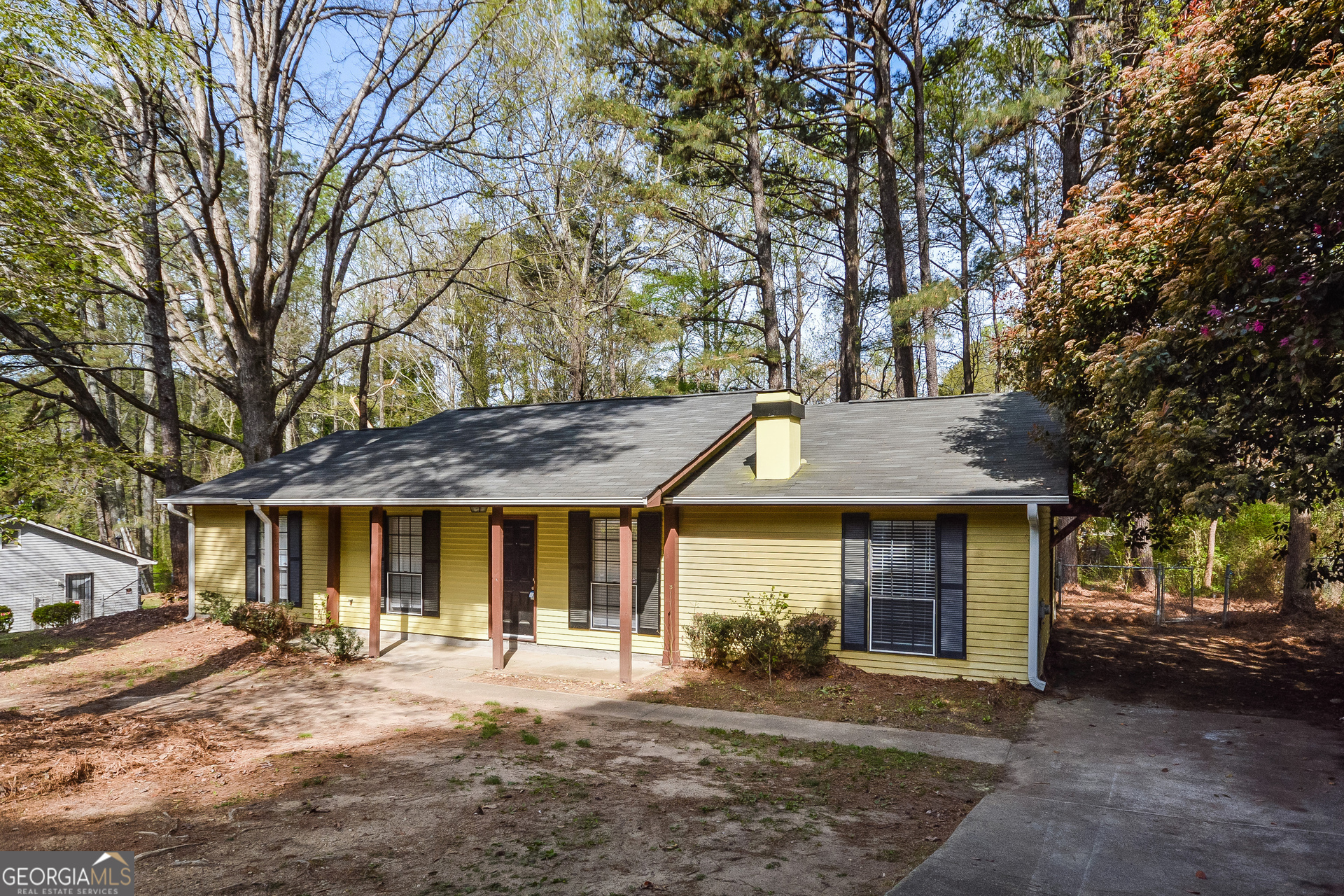 a front view of a house with a yard and porch