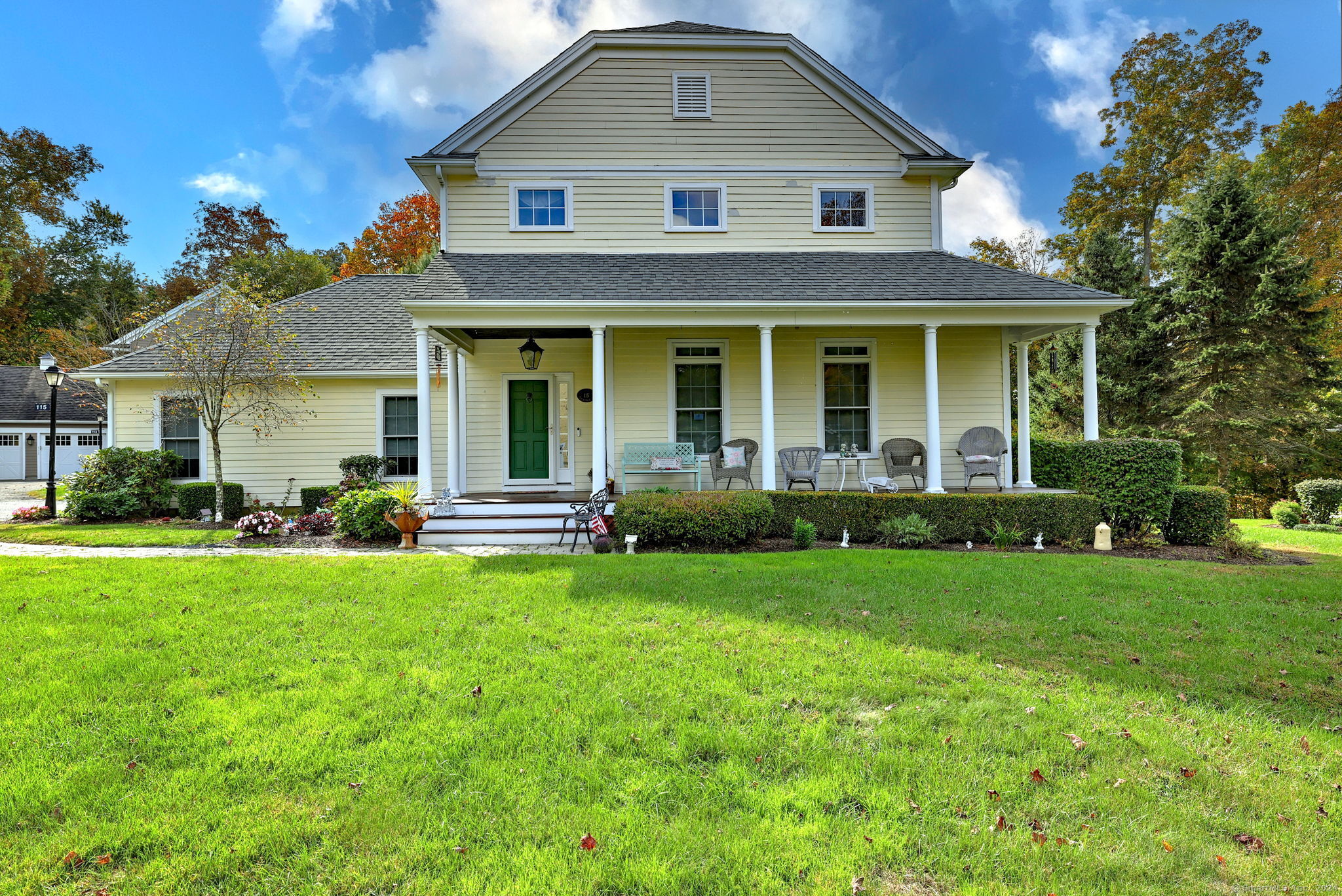 a front view of a house with a garden