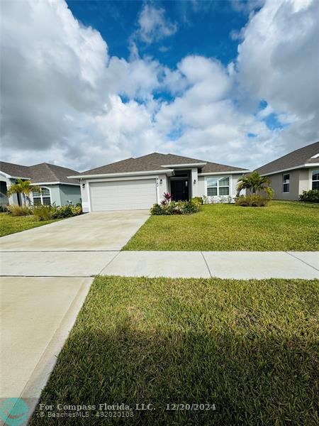 a front view of house with yard