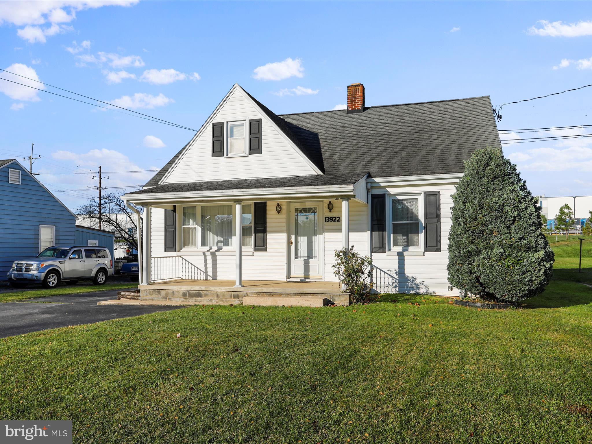 a front view of a house with a yard and porch