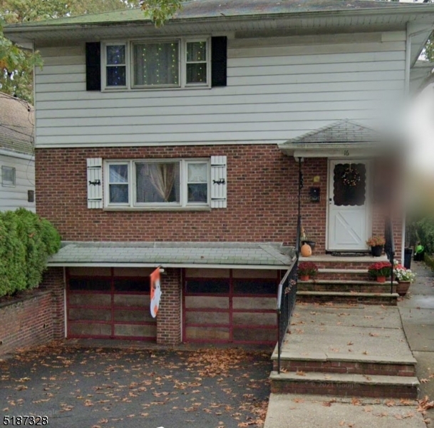 a front view of a house with stairs