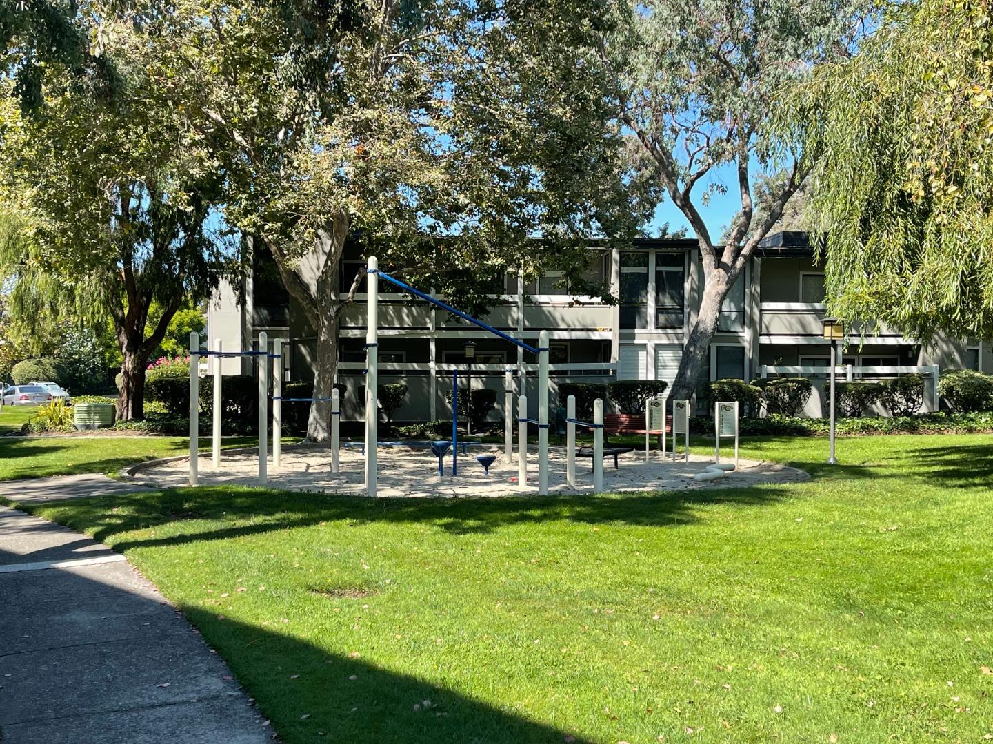 a view of a house with swimming pool and sitting area