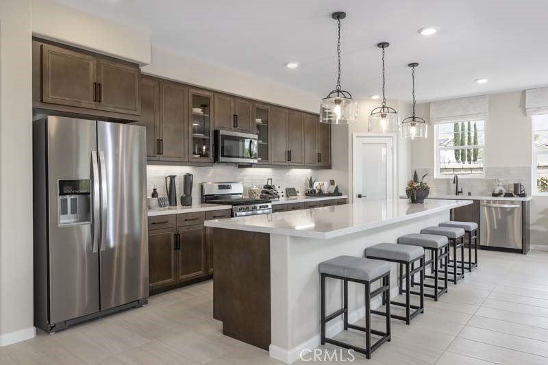 a kitchen with counter space cabinets and stainless steel appliances