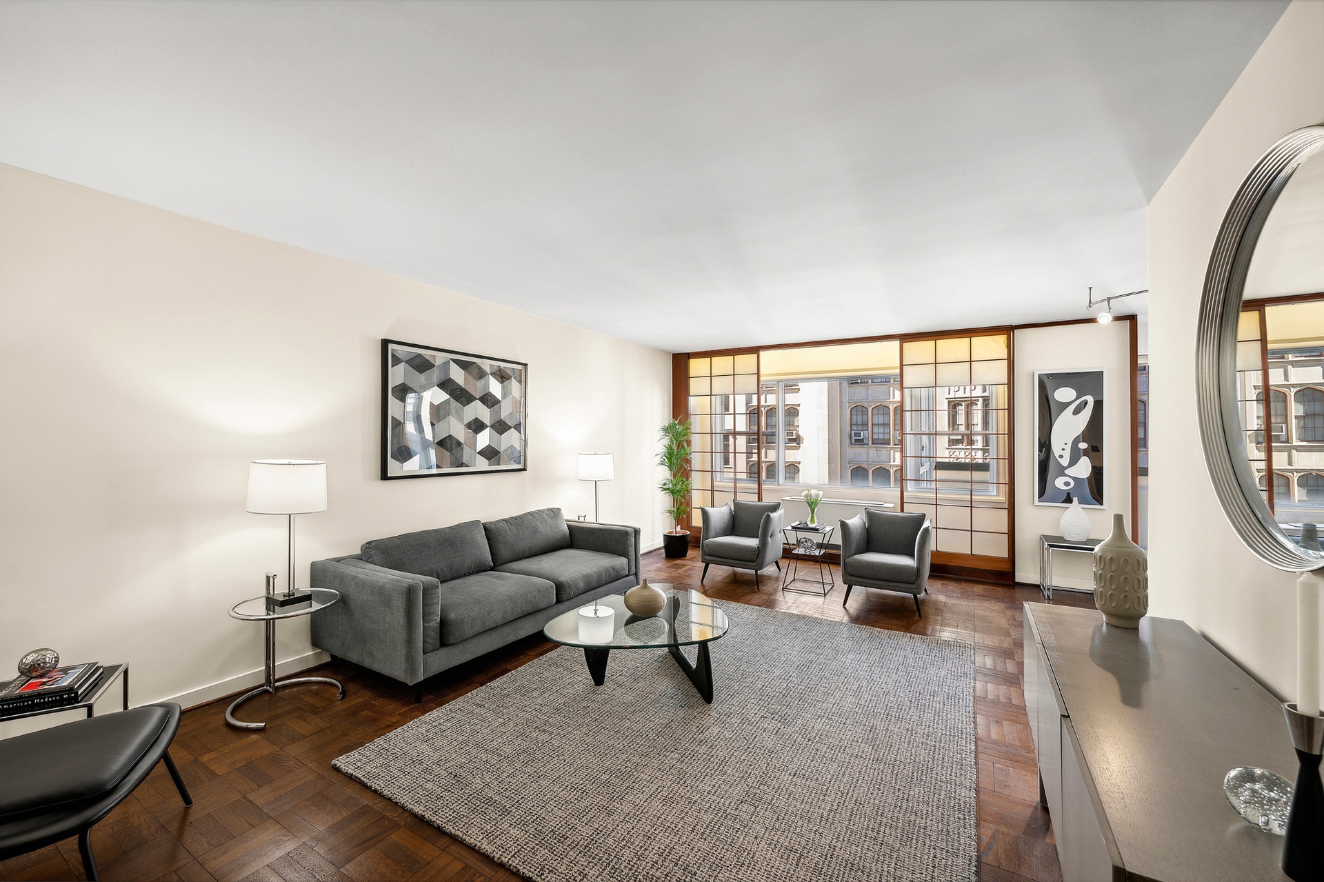 a living room with furniture and a large window