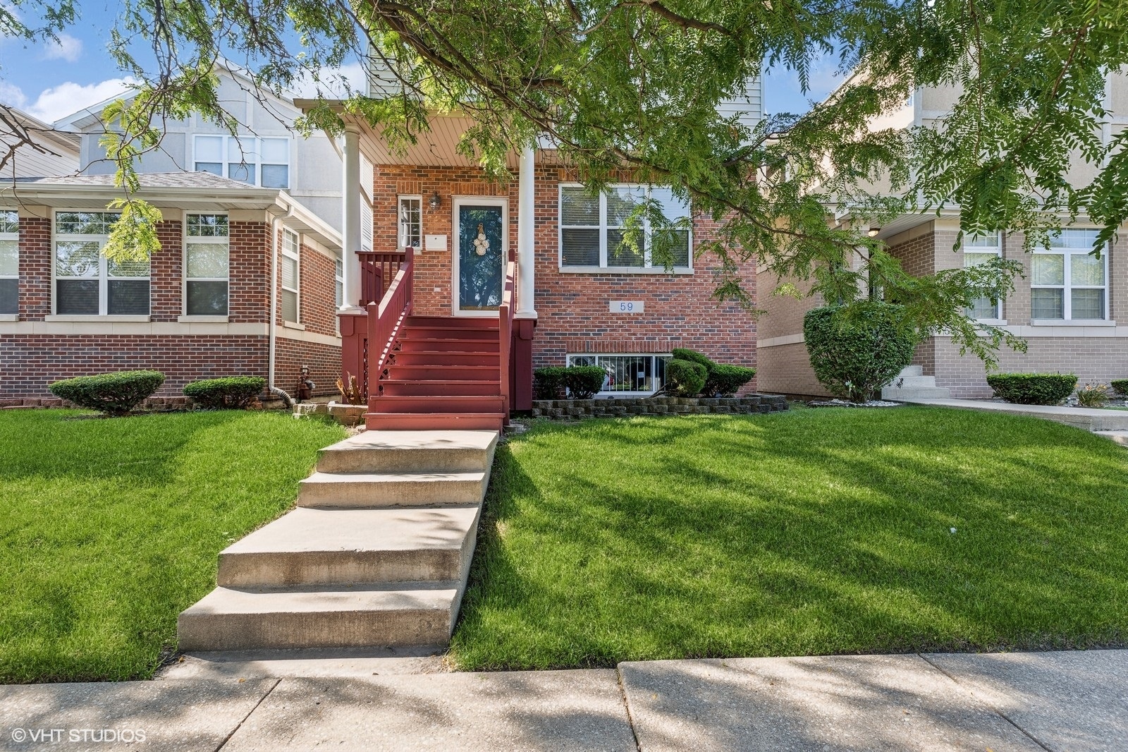 a front view of a house with a yard