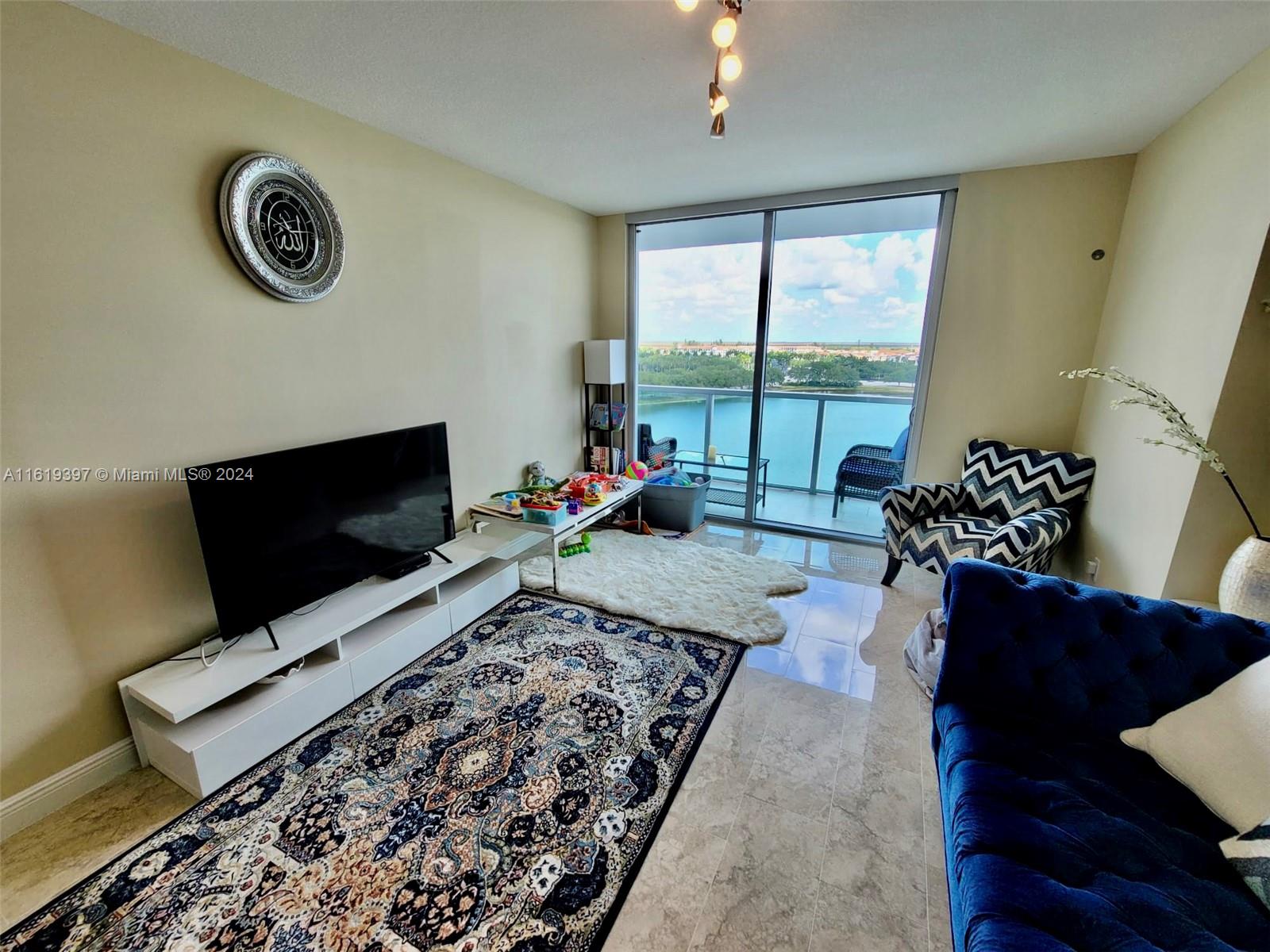 a living room with furniture and a flat screen tv