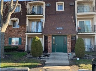 a front view of a house with yard