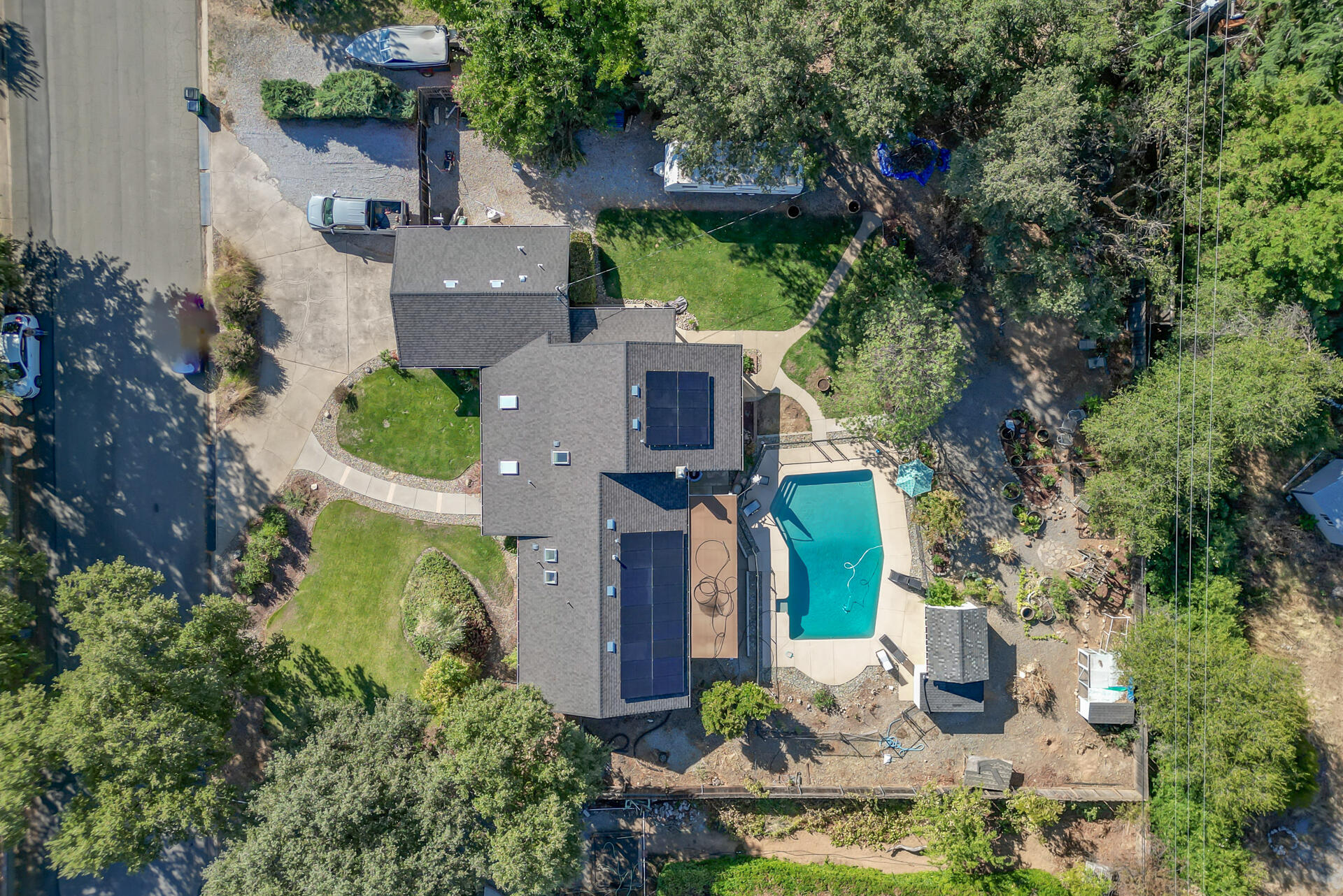 an aerial view of a house with outdoor space