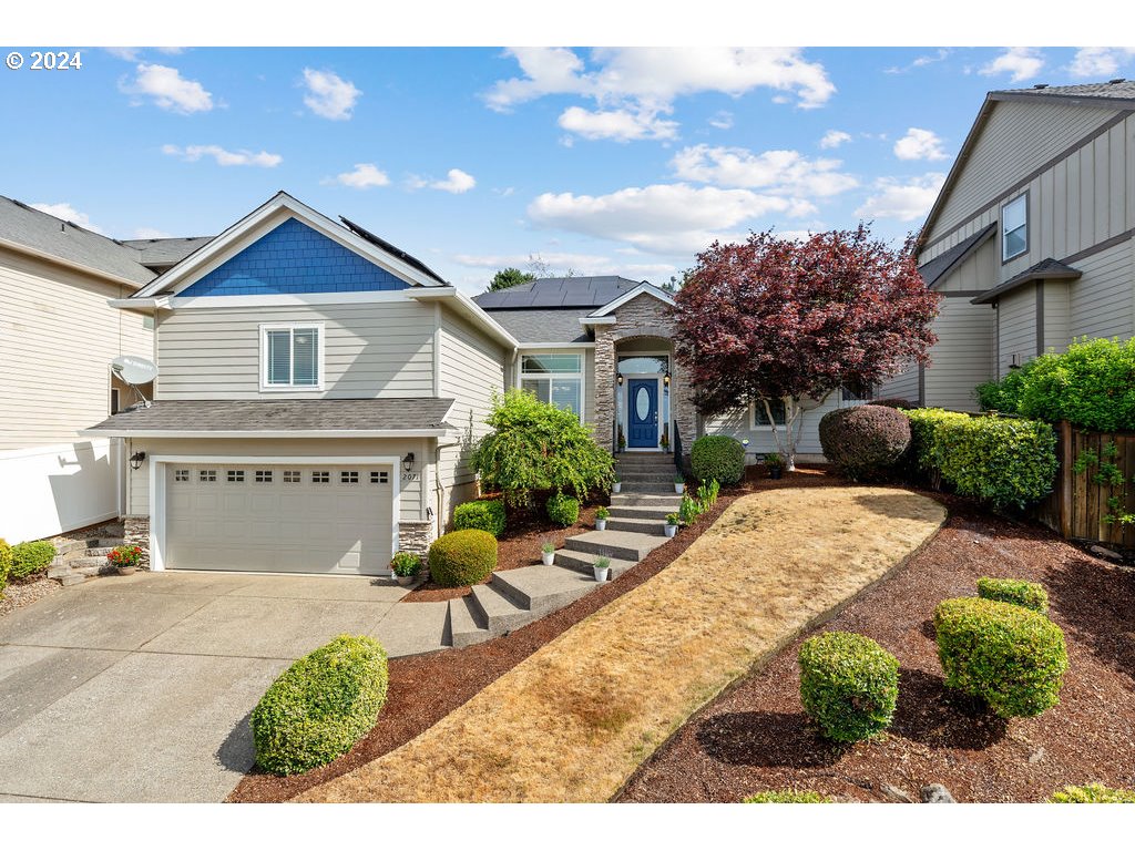 a view of house with yard and entertaining space