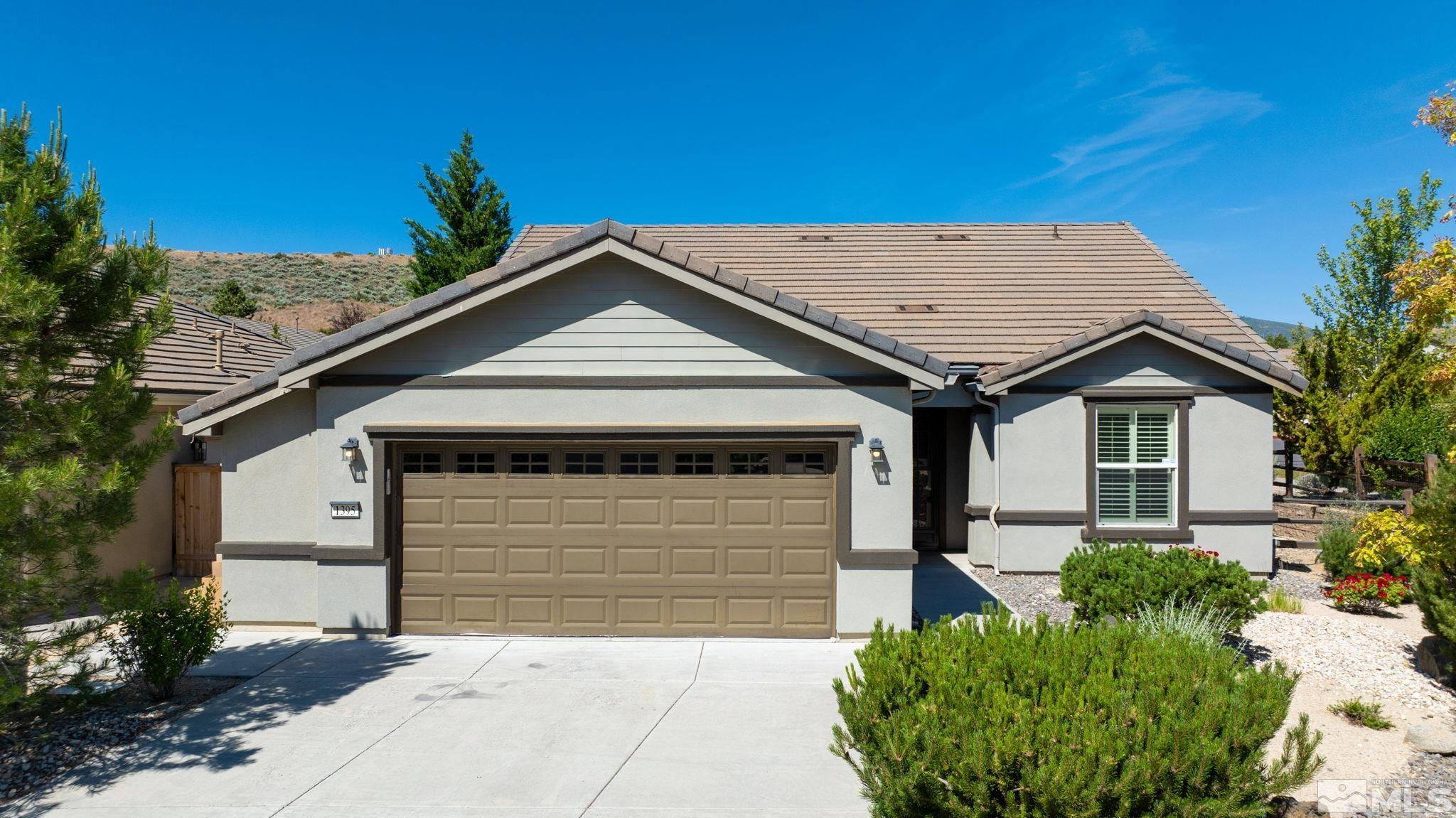 a front view of a house with a garage