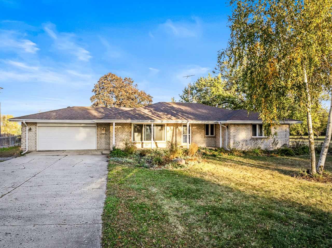 front view of a house with a yard