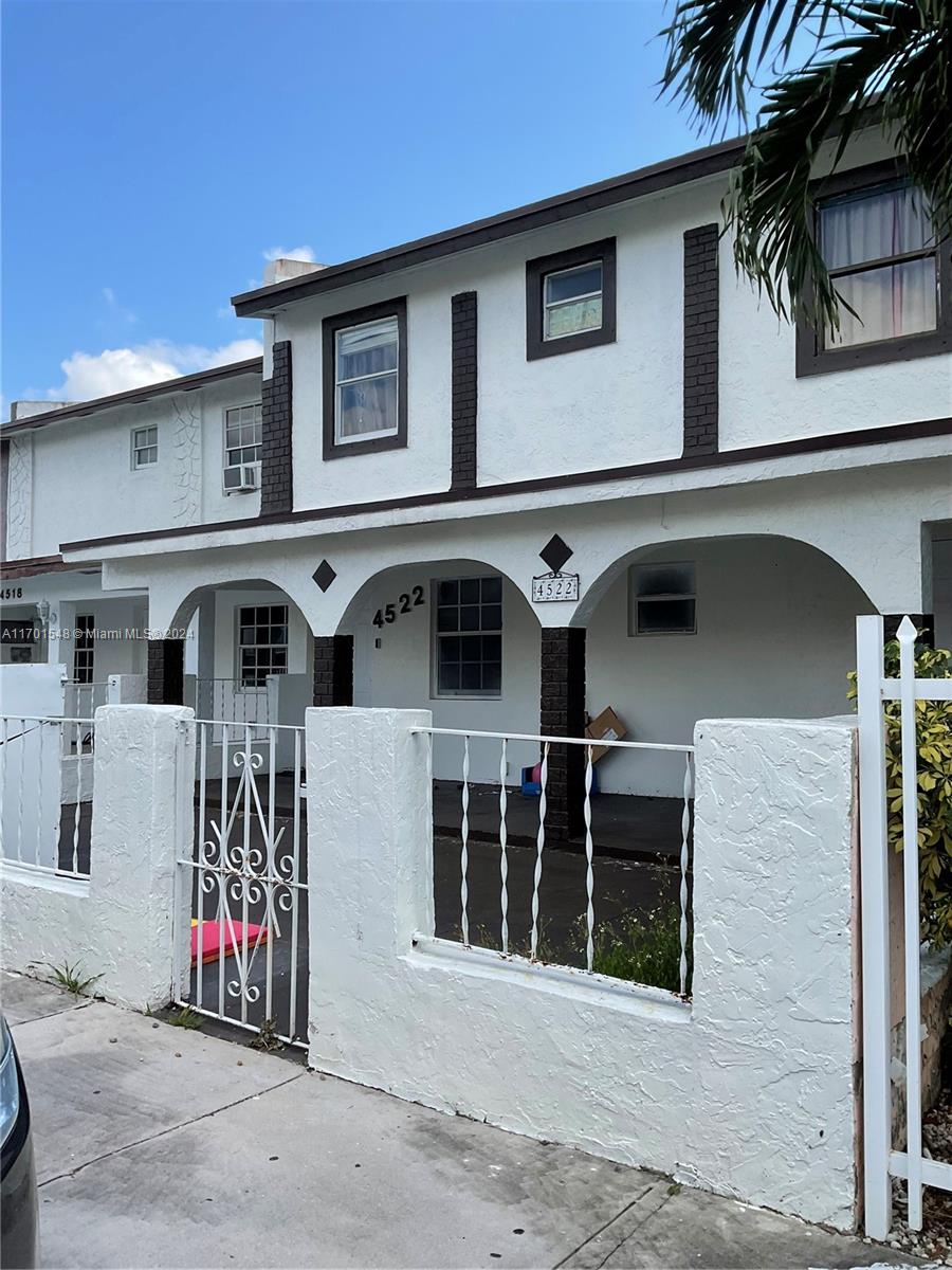 a front view of a house with a garage