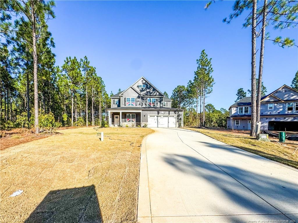 a view of a house with cars park