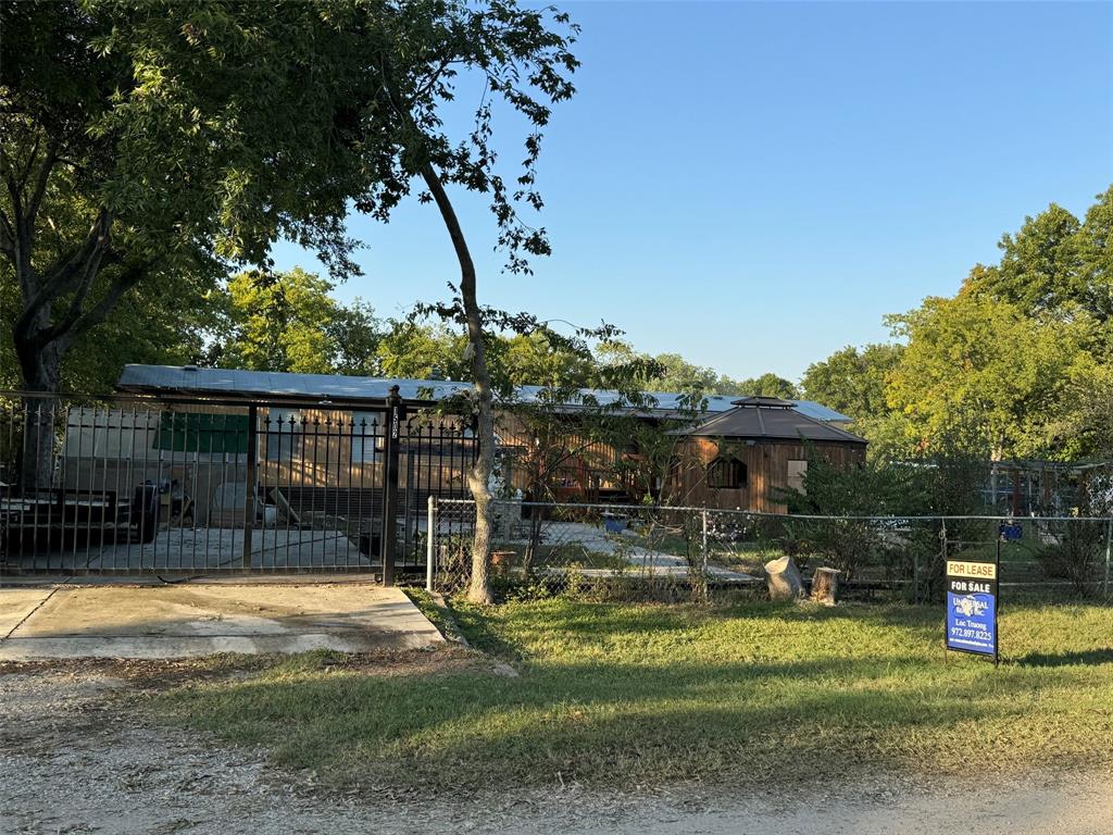 a view of a house with backyard porch and sitting area