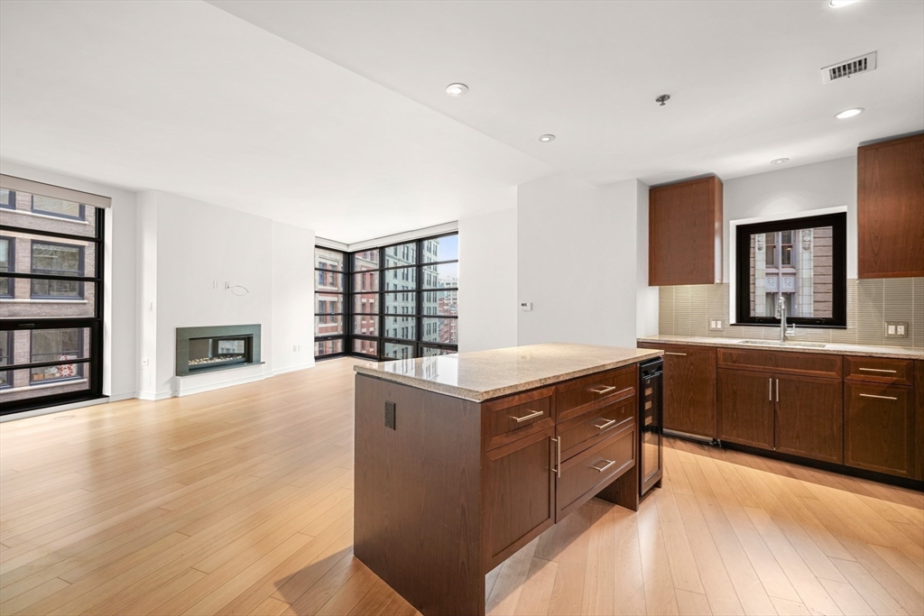 a kitchen with stainless steel appliances granite countertop a stove and a sink