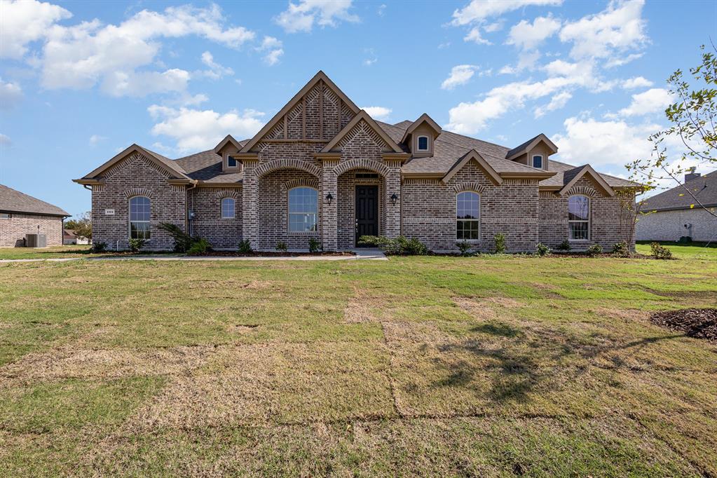 a front view of a house with a yard