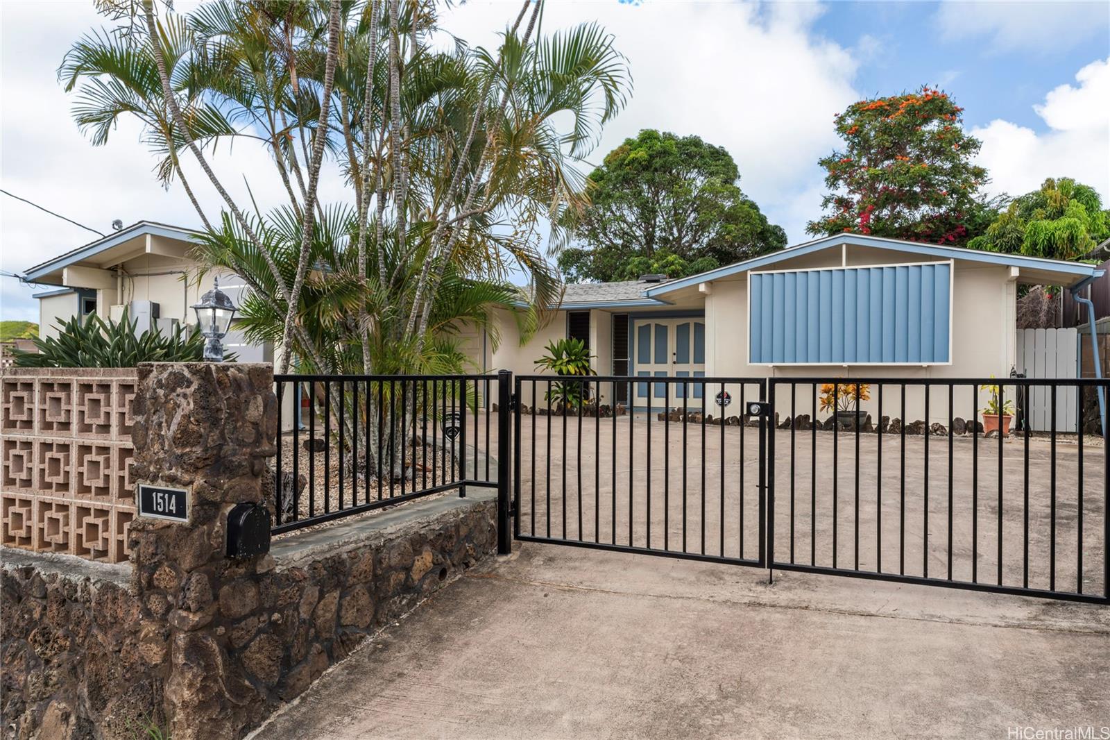 a view of a wrought iron fences in front of house