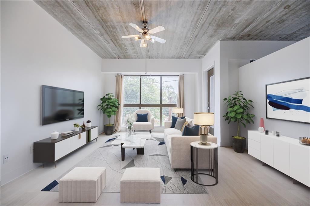 a living room with furniture a flat screen tv and a large window