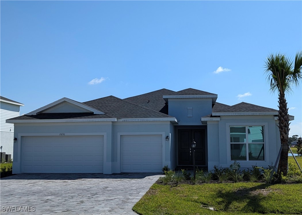 a front view of a house with a yard