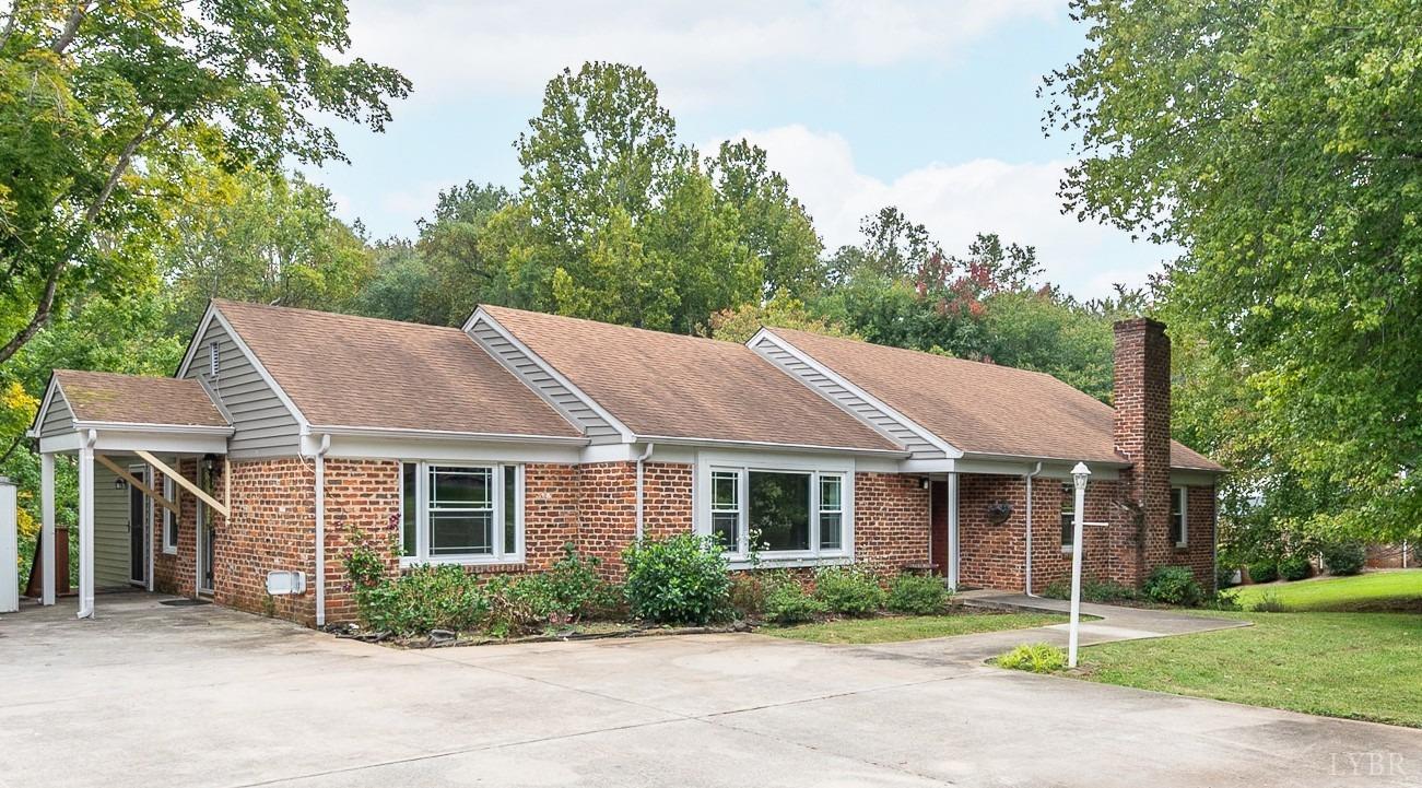 a aerial view of a house with a yard