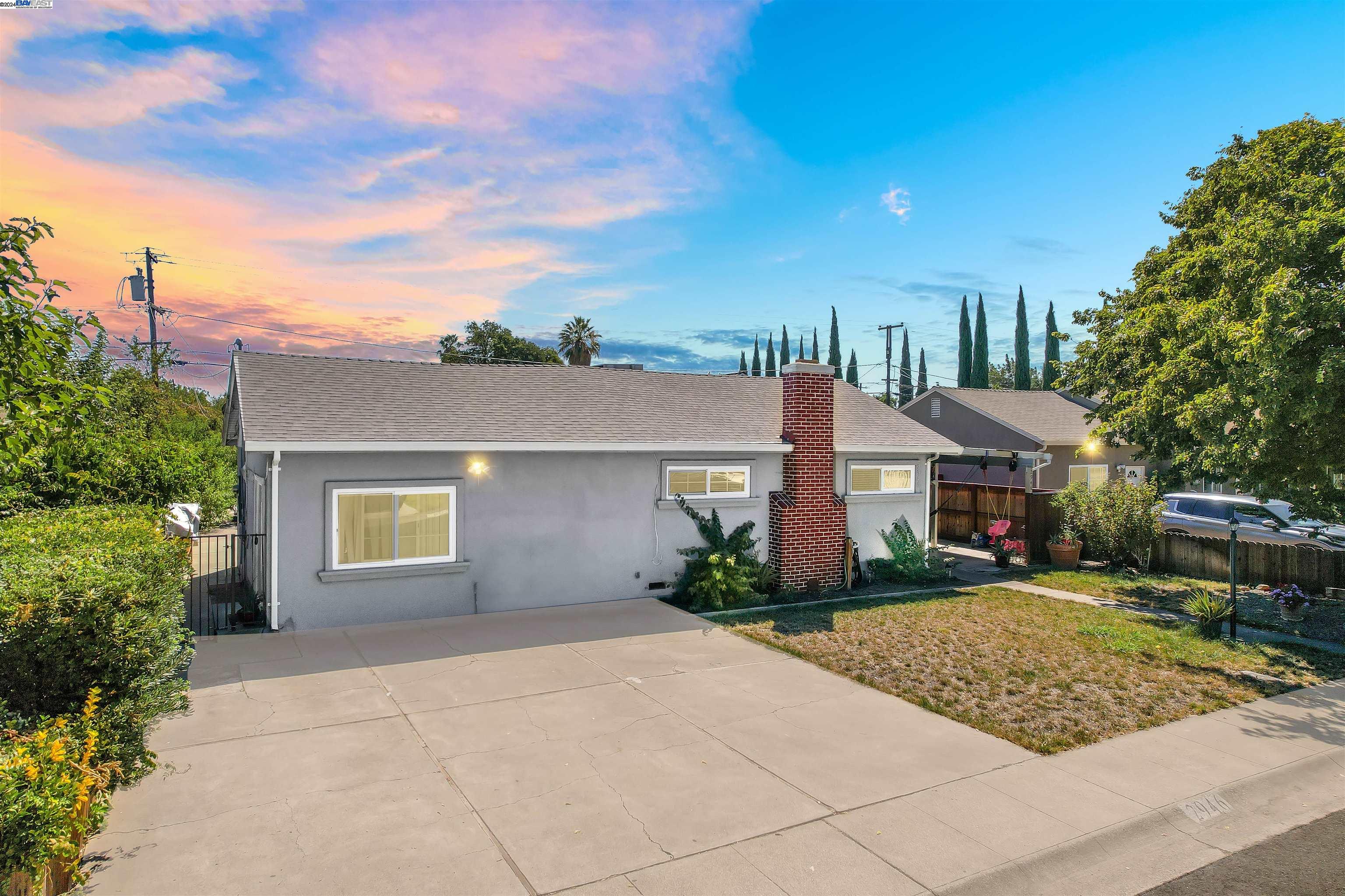 front view of a house with a yard