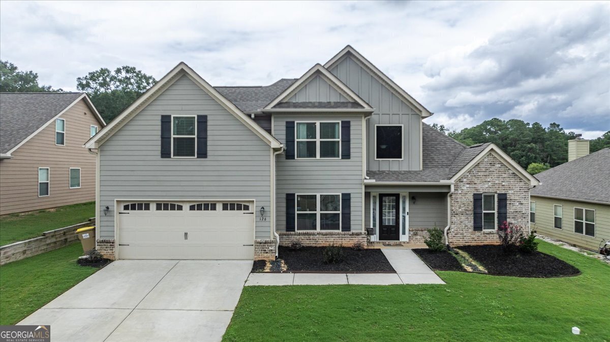 a front view of a house with a yard