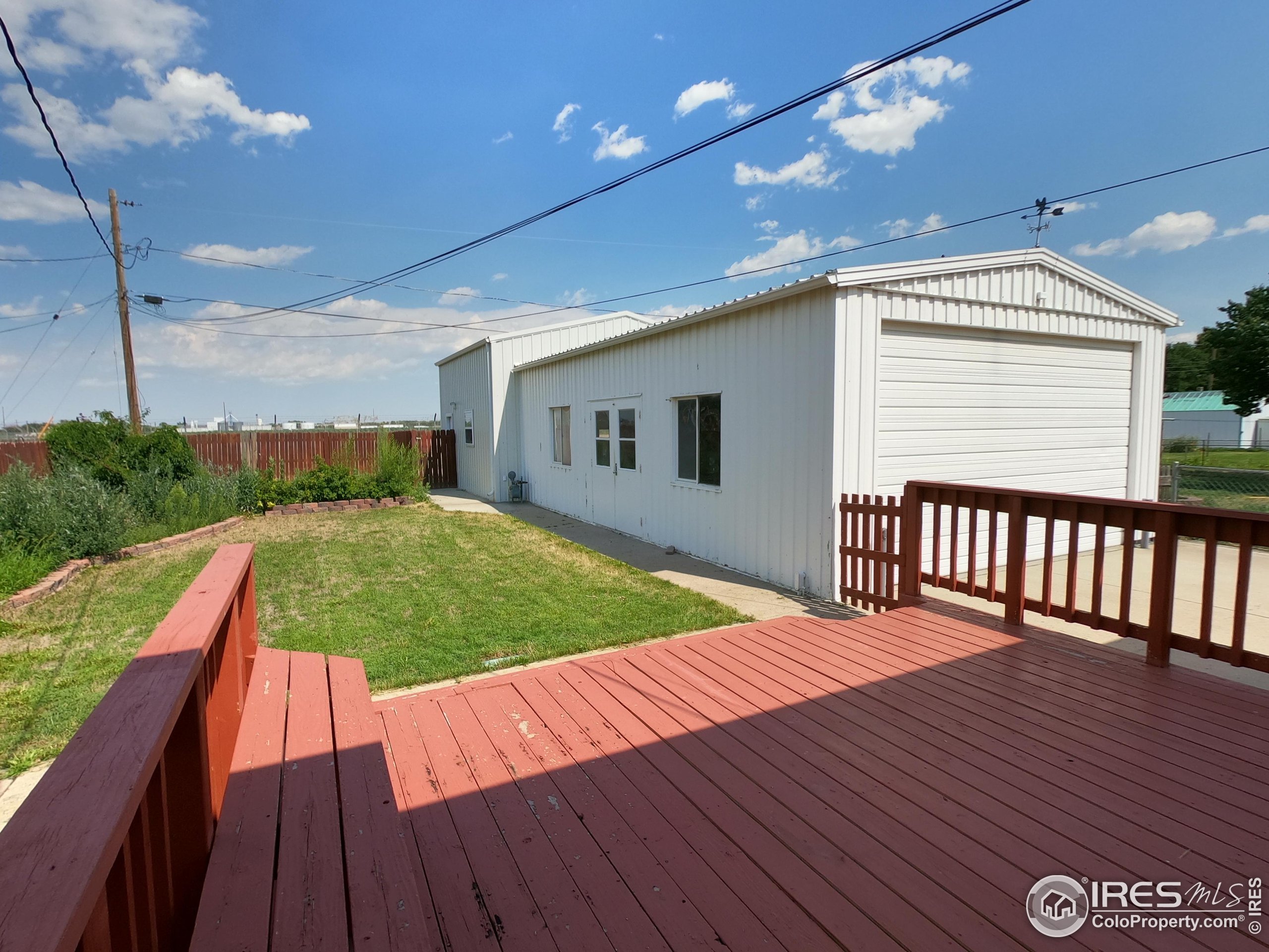 a view of outdoor space with deck and living room