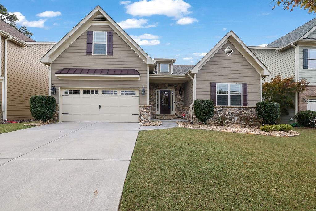 a front view of a house with a yard