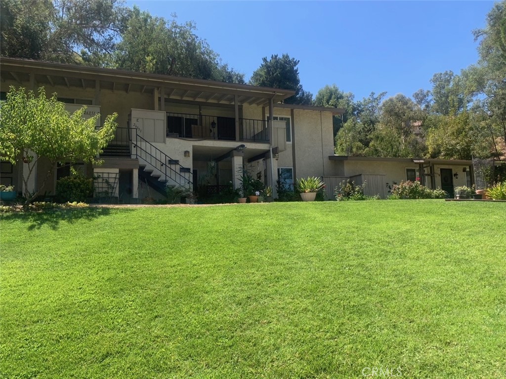 a view of house with garden