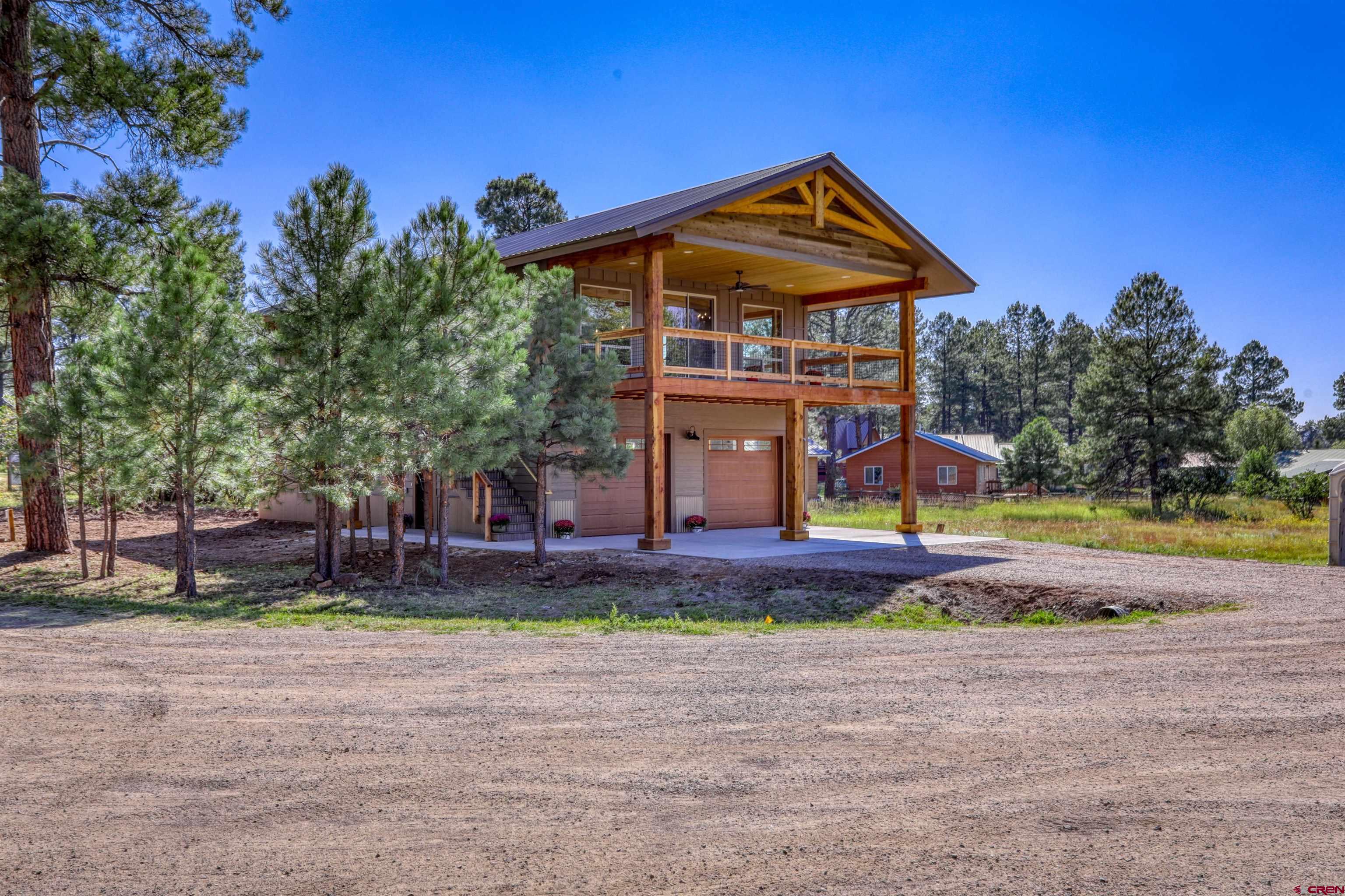 a front view of house with yard and entertaining space