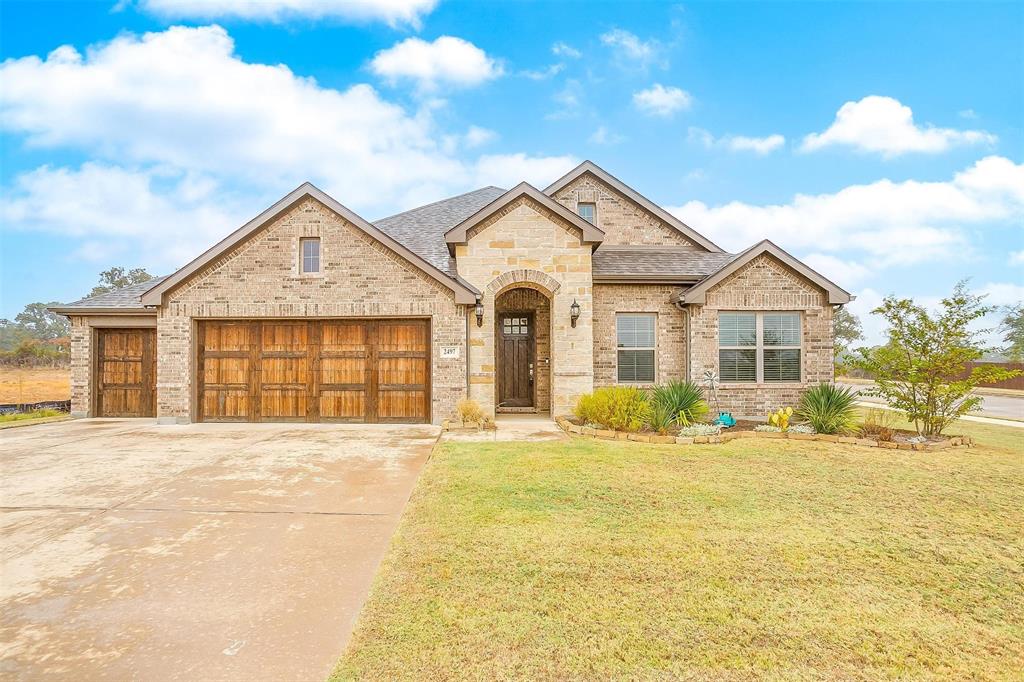 a front view of a house with a yard