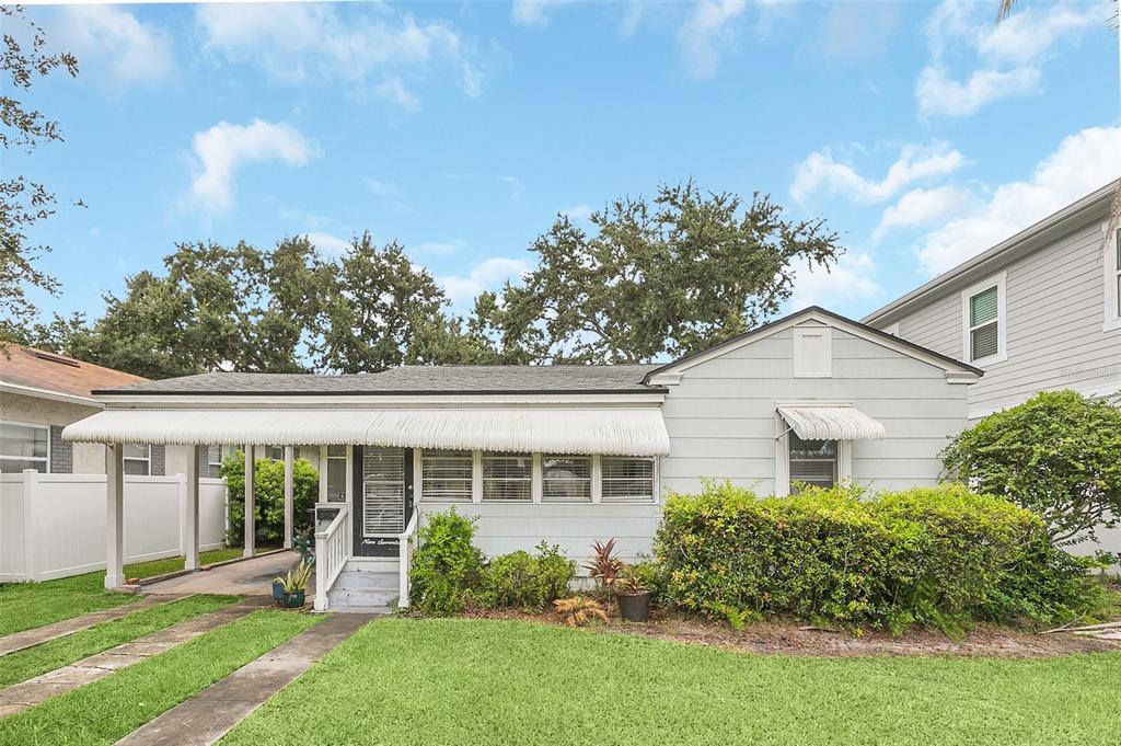 front view of a house with a yard