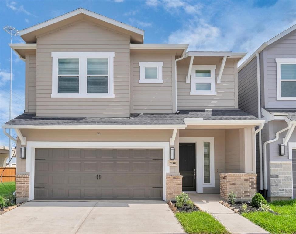 a front view of a house with a garage