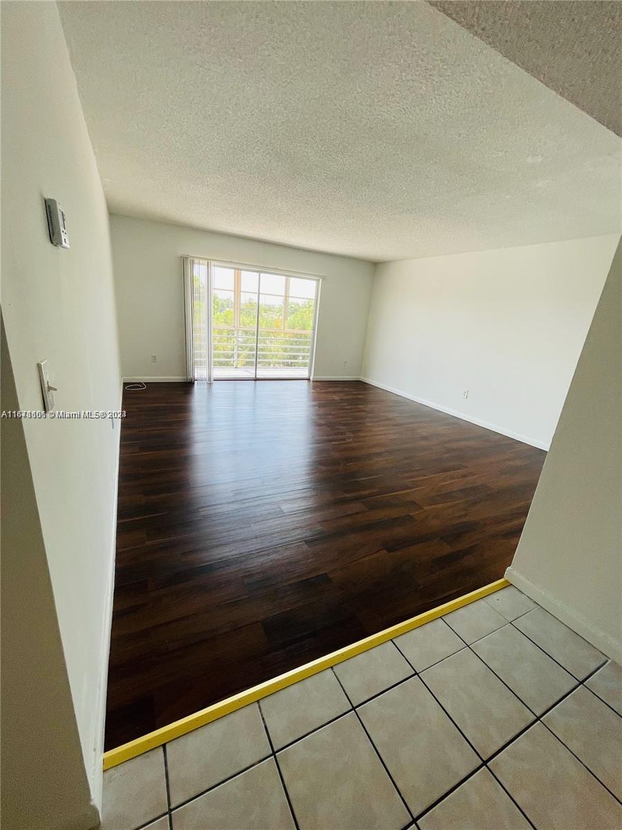 a view of wooden floor with staircase