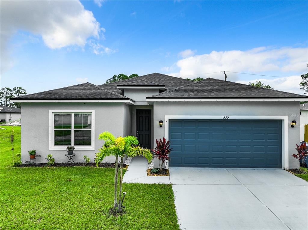 front view of a house with a yard