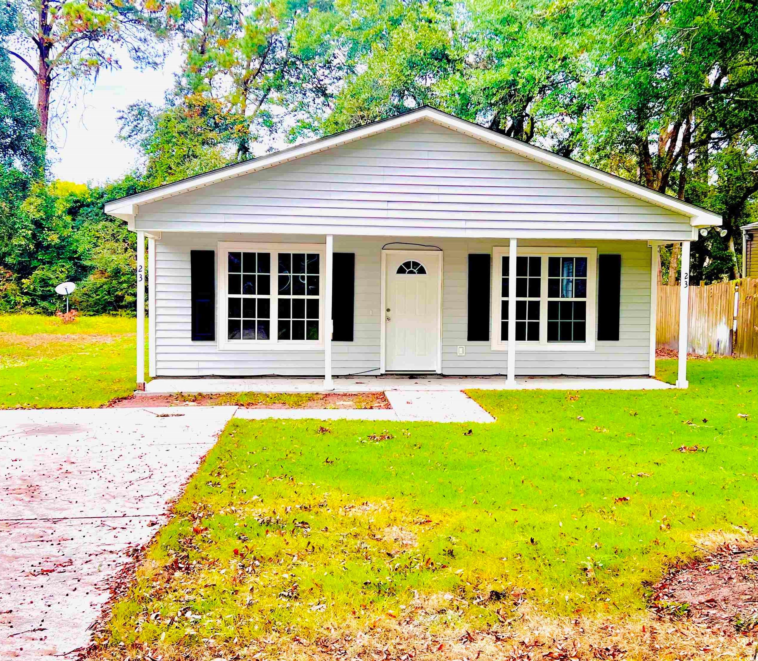 View of front of property featuring a front yard a