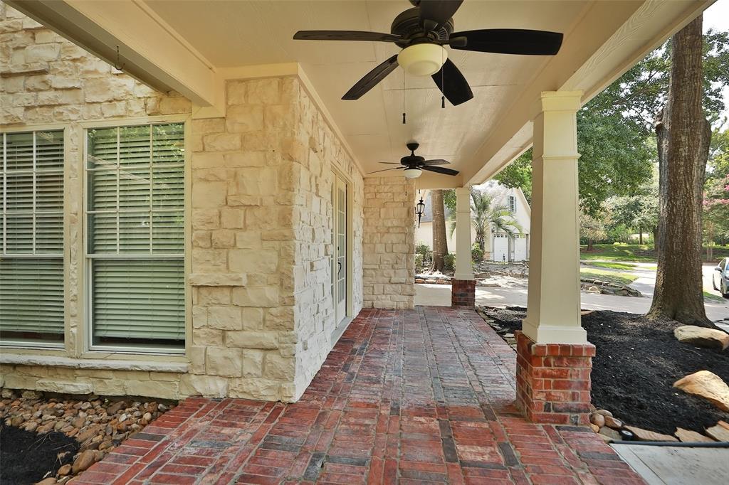 a view of a porch with a table and chairs