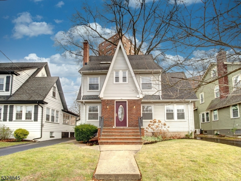 a front view of a house with a yard