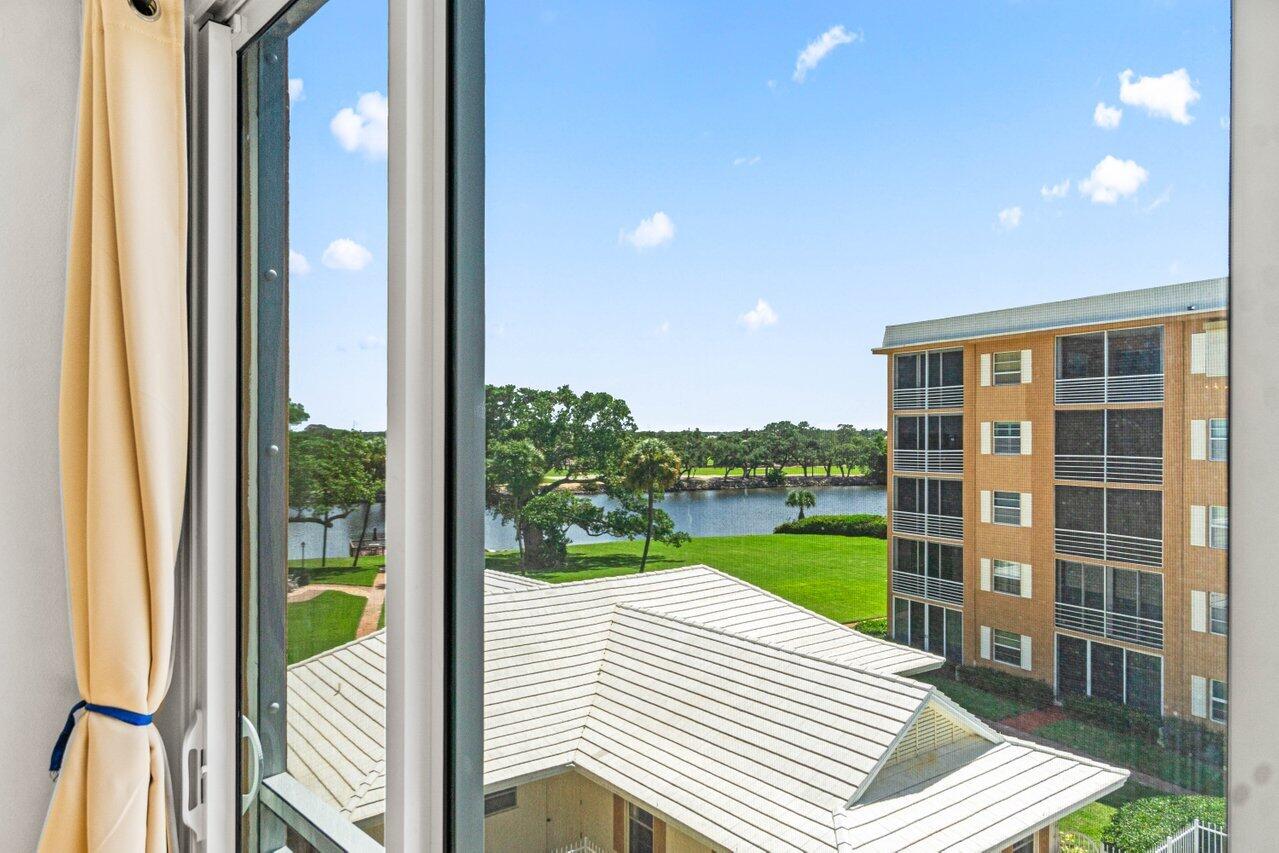 a view of a balcony with a garden and plants