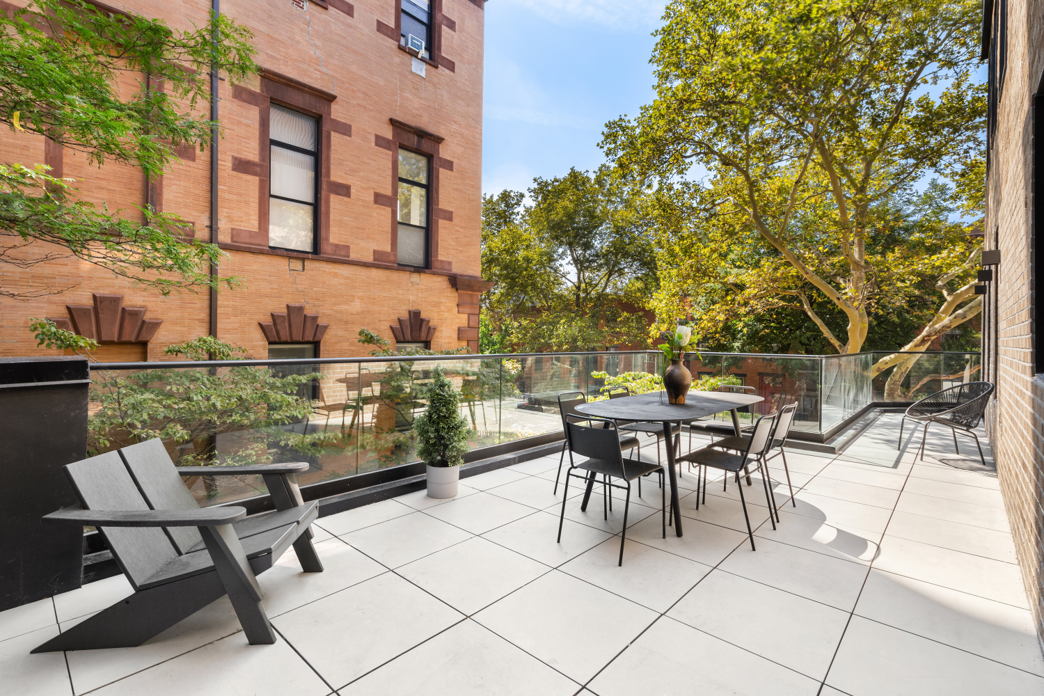 a view of a patio with a table and chairs