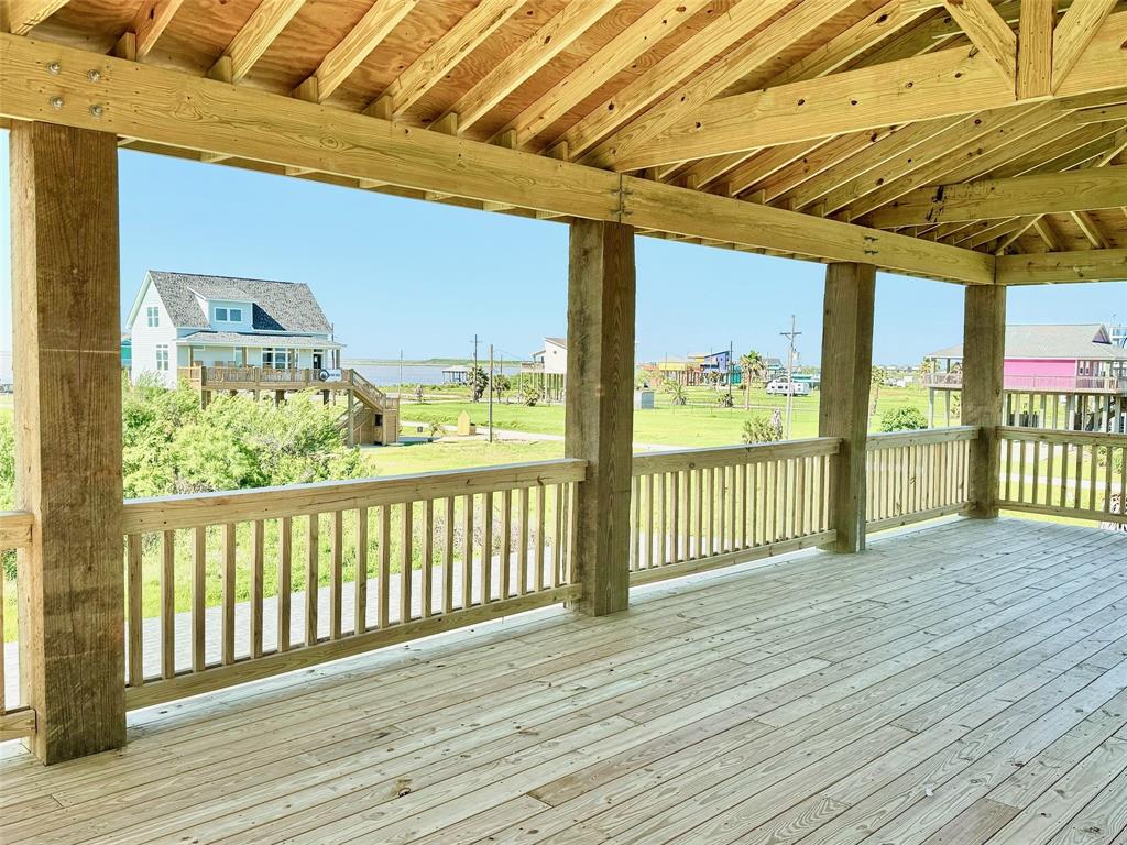 a view of a balcony with wooden floor