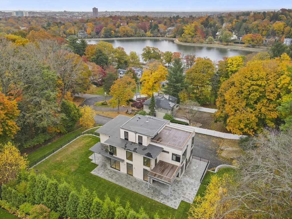 an aerial view of a house with a lake view