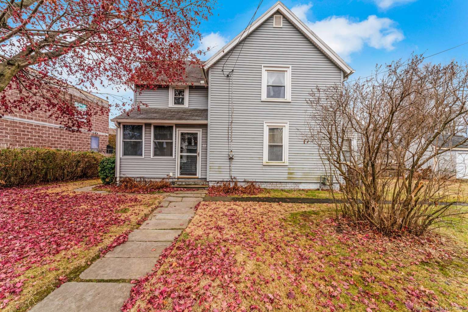 a front view of a house with a yard