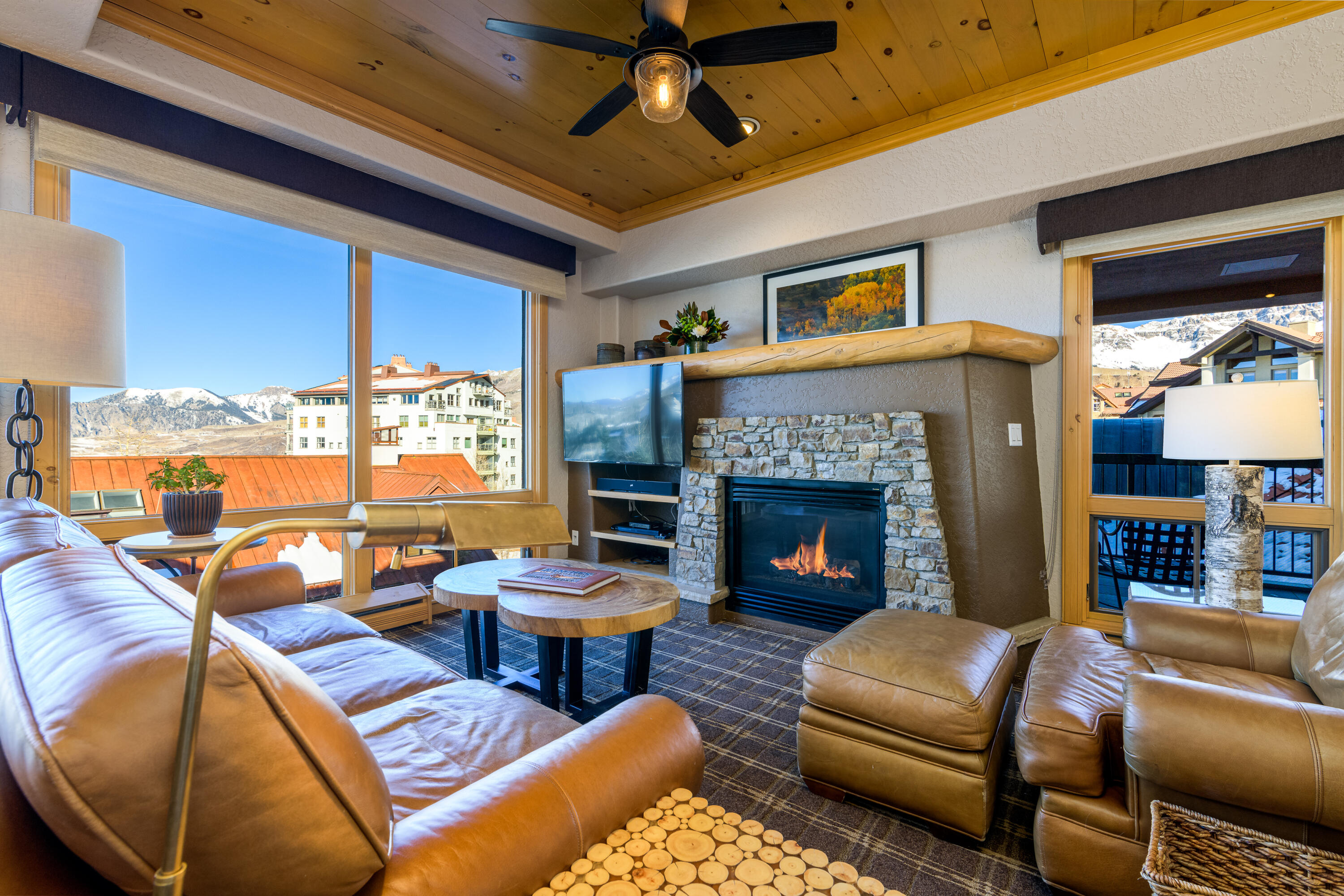 a living room with furniture and a fireplace