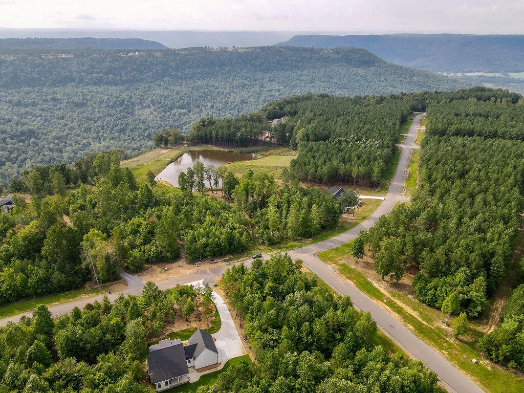 an aerial view of residential house with outdoor space and river